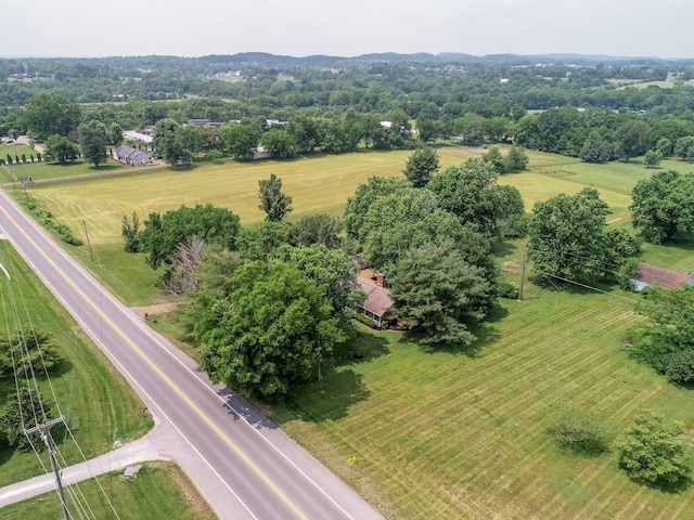 birds eye view of property featuring a rural view