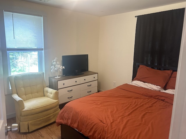 bedroom featuring wood finished floors