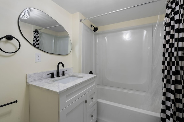 bathroom featuring shower / tub combo and vanity