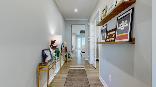 hall featuring ornamental molding, recessed lighting, light wood-style flooring, and baseboards