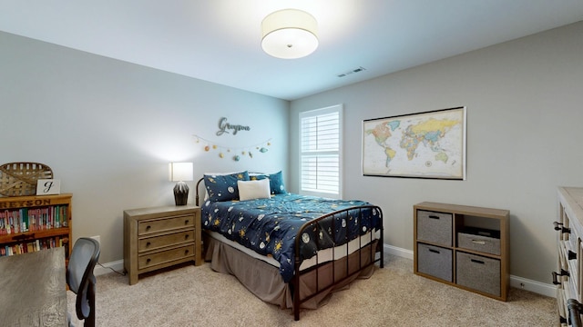 bedroom featuring light carpet, baseboards, and visible vents