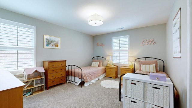 bedroom featuring carpet and visible vents