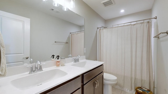 full bath featuring toilet, visible vents, and a sink