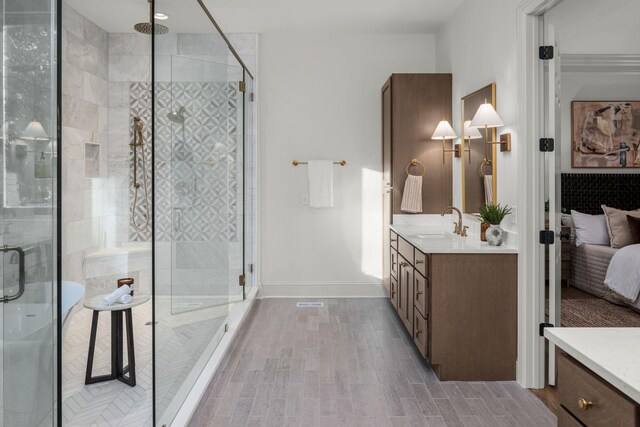5042 Hill Place Dr, Nashville, TN 37205 - bathroom featuring a shower stall, wood tiled floor, baseboards, and vanity