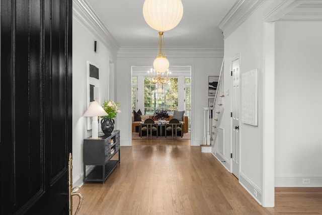 5042 Hill Place Dr, Nashville, TN 37205 - foyer featuring baseboards, wood finished floors, stairs, crown molding, and a notable chandelier
