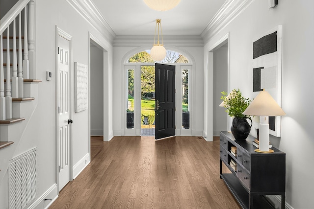 5042 Hill Place Dr, Nashville, TN 37205 - entrance foyer with stairway, visible vents, wood finished floors, and ornamental molding