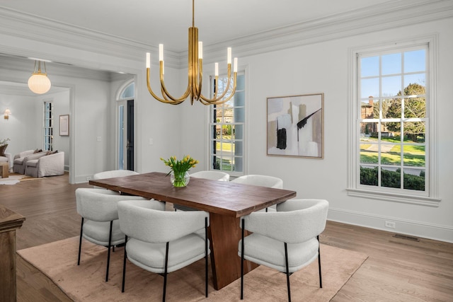 5042 Hill Place Dr, Nashville, TN 37205 - dining room featuring a notable chandelier, crown molding, and wood finished floors