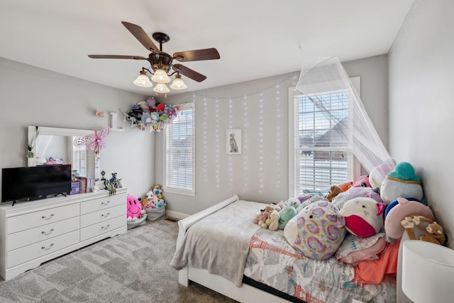 bedroom featuring ceiling fan, carpet, and baseboards