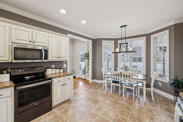 kitchen with baseboards, stainless steel appliances, crown molding, and a chandelier