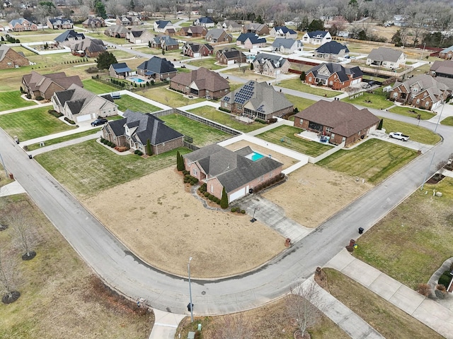 birds eye view of property with a residential view