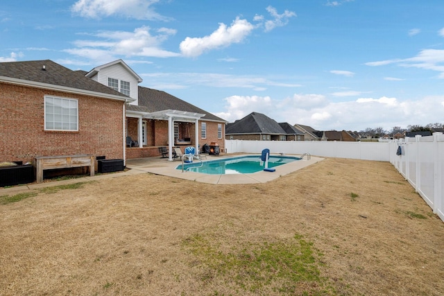 view of pool with a patio area, a fenced backyard, a pergola, and a yard