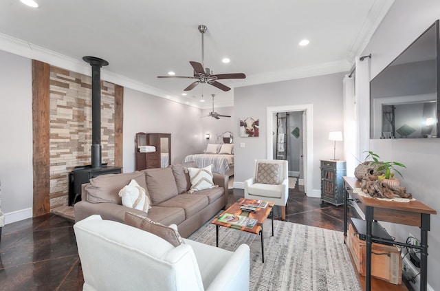 living room with baseboards, recessed lighting, a wood stove, and crown molding