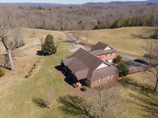 bird's eye view with a rural view and a view of trees