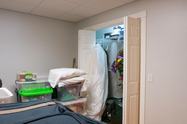 bedroom featuring a closet and a paneled ceiling