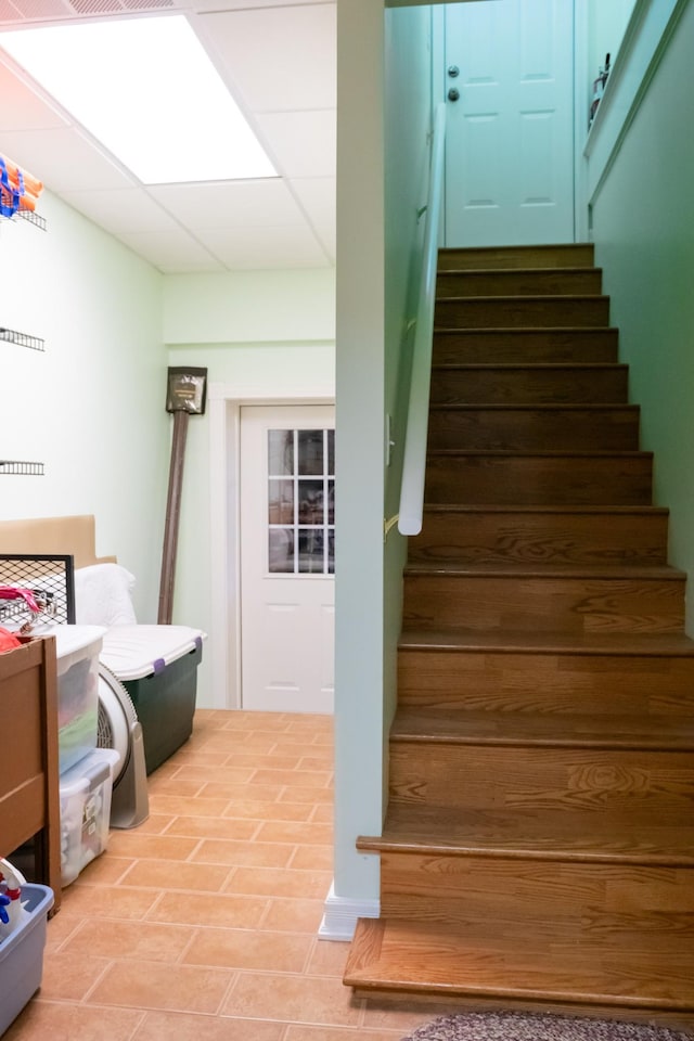 stairway with a drop ceiling