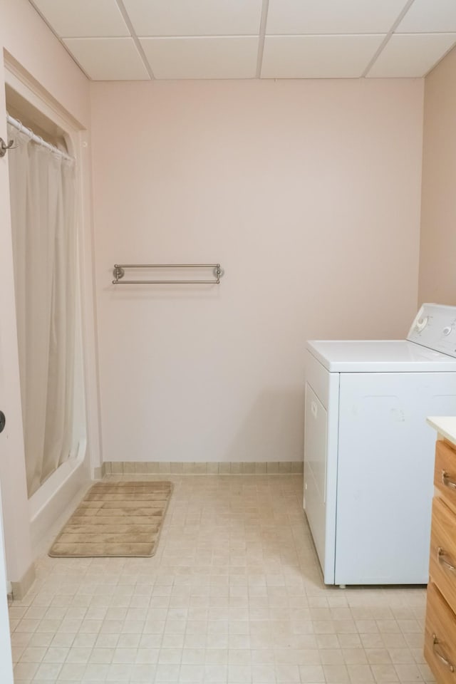 clothes washing area featuring laundry area and washer / clothes dryer