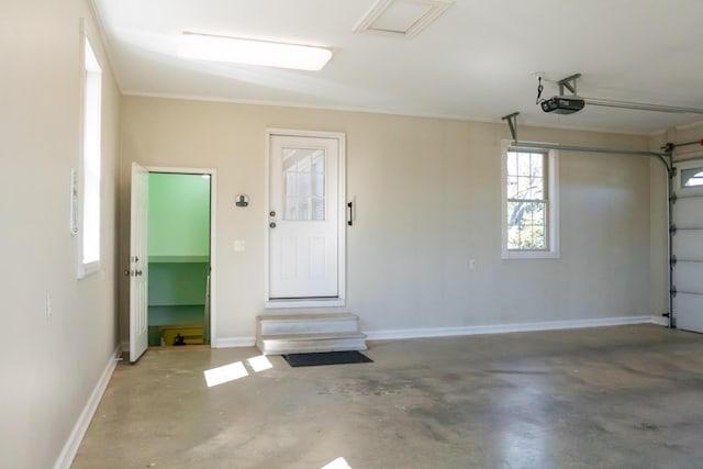 garage with baseboards and a garage door opener