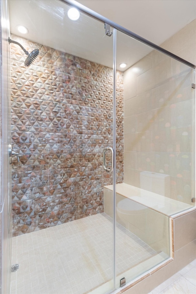 full bathroom featuring a stall shower and recessed lighting