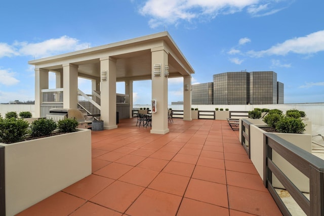 view of patio / terrace featuring outdoor dining space and a water view