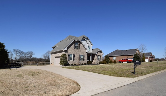 view of front of home featuring a garage, a front yard, driveway, and fence