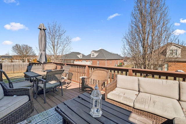 deck with a residential view, outdoor lounge area, and outdoor dining space