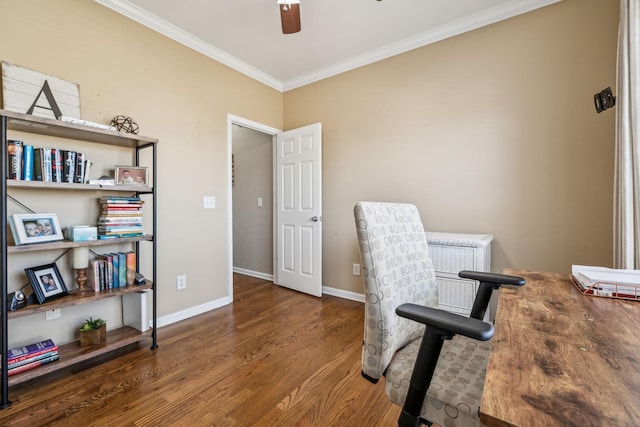 office space with ornamental molding, ceiling fan, baseboards, and wood finished floors