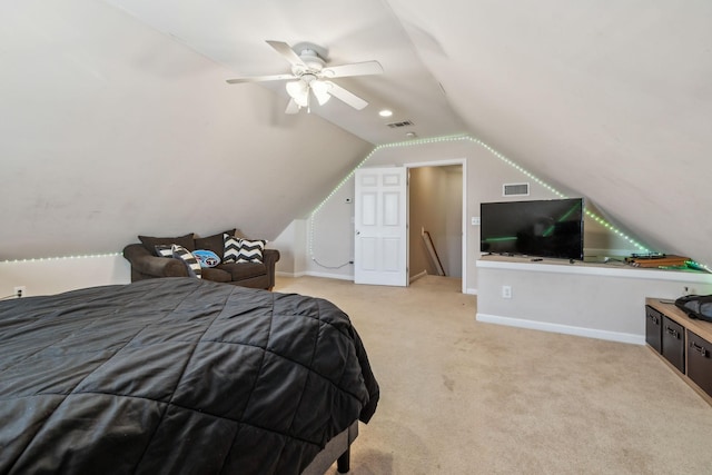 bedroom with lofted ceiling, light colored carpet, visible vents, and baseboards