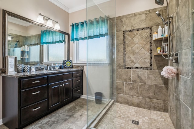 full bathroom with a shower stall, crown molding, and vanity