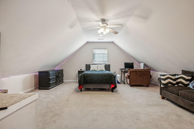 bedroom with vaulted ceiling, carpet flooring, a ceiling fan, and baseboards