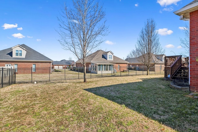 view of yard with a fenced backyard