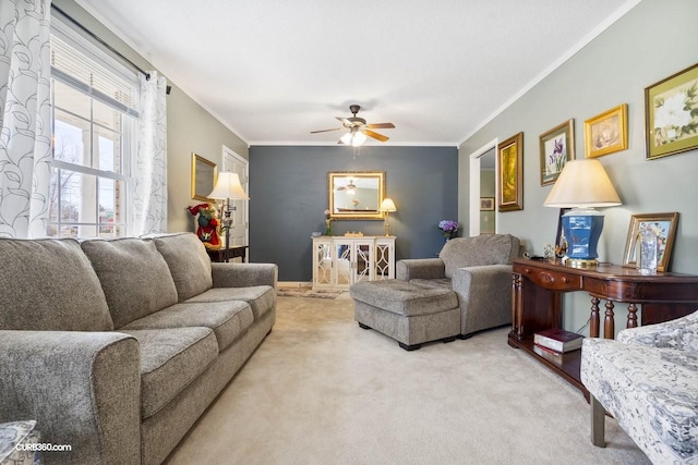 living room featuring carpet floors, a ceiling fan, and crown molding