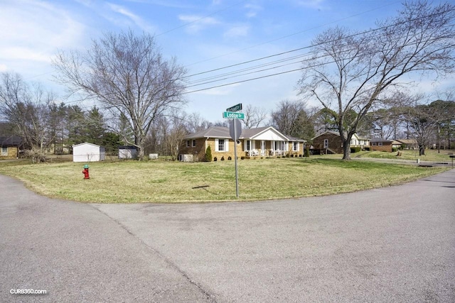 view of front facade featuring a garage, a chimney, and a front lawn