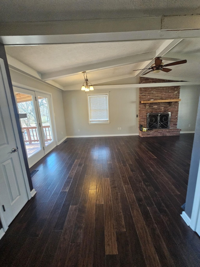 unfurnished living room featuring a fireplace, baseboards, dark wood-style flooring, and beamed ceiling