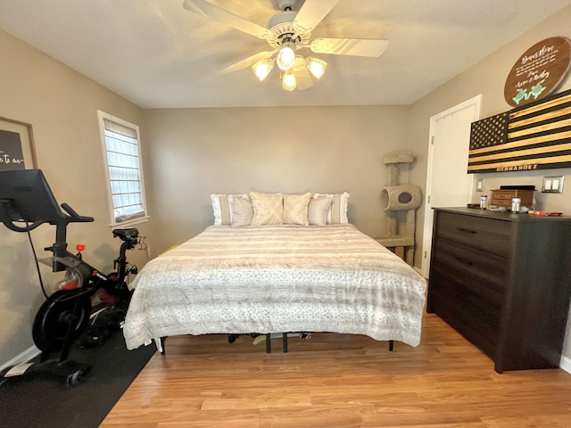 bedroom featuring light wood-style floors and ceiling fan