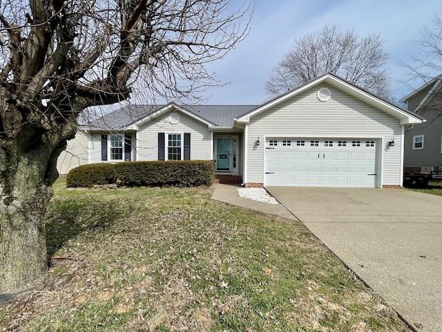 single story home with an attached garage, driveway, metal roof, and a front yard