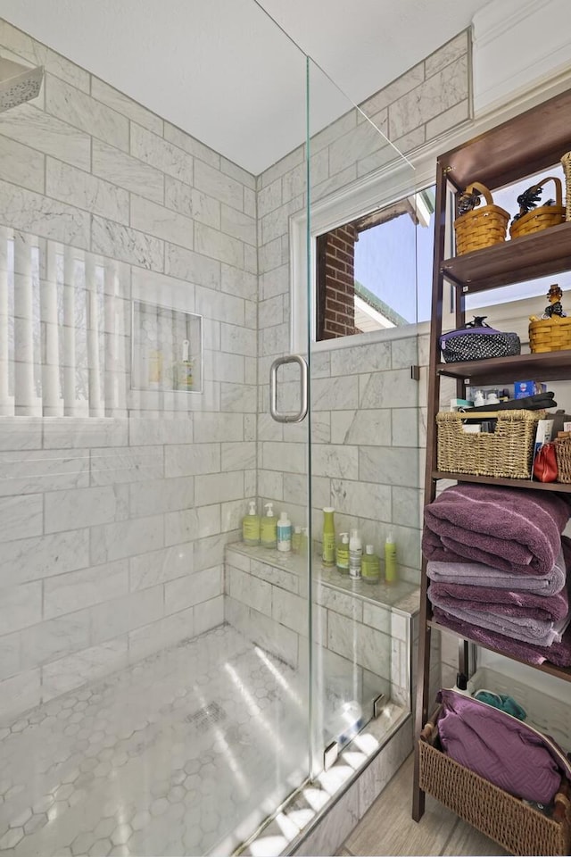 bathroom with a shower stall