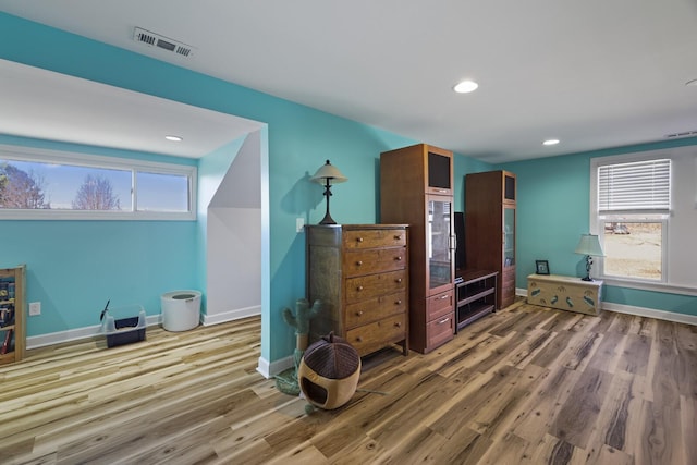 bedroom featuring recessed lighting, visible vents, baseboards, and wood finished floors
