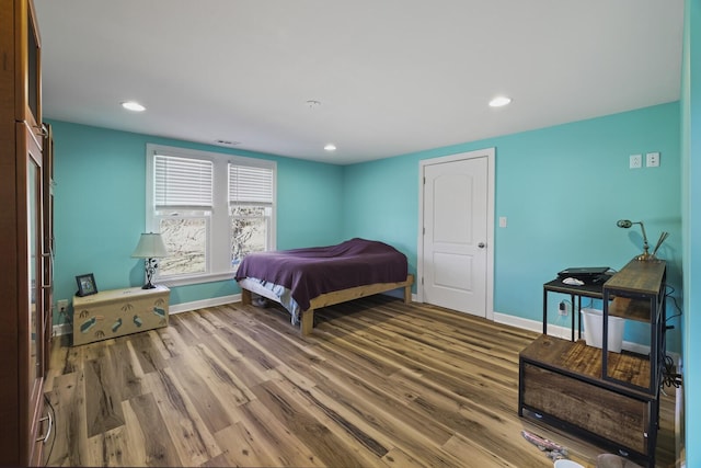 bedroom featuring recessed lighting, baseboards, and wood finished floors