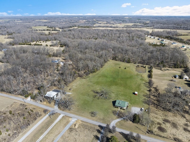 birds eye view of property with a rural view