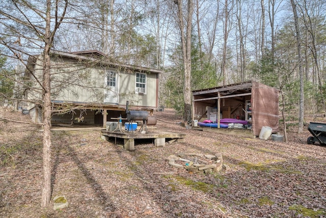 rear view of house with a pole building and an outdoor structure