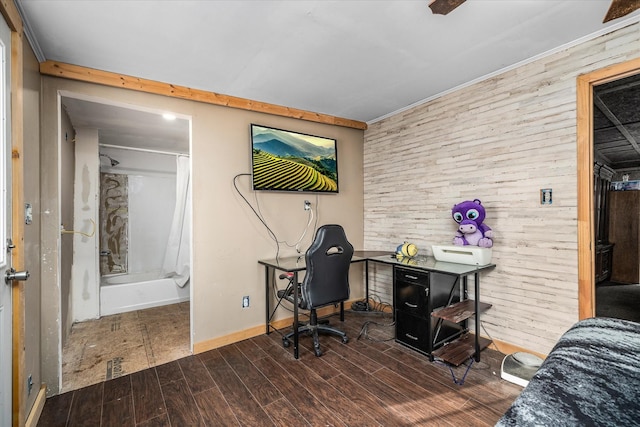 office area with wood tiled floor, crown molding, and baseboards