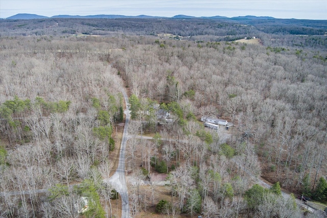 aerial view featuring a forest view and a mountain view