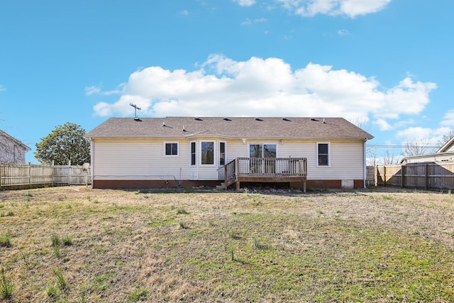 back of house featuring crawl space, a fenced backyard, a lawn, and a wooden deck