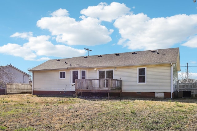 back of house with a yard, crawl space, fence, and a deck