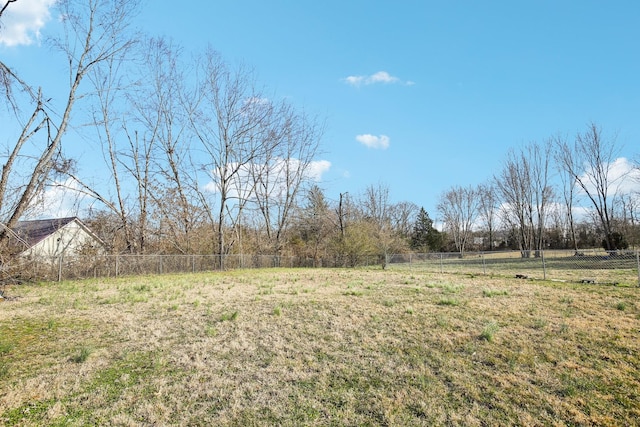 view of yard featuring a rural view and fence