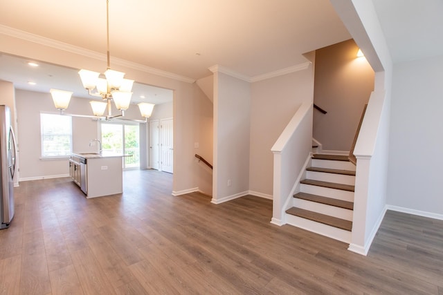 kitchen with stainless steel appliances, light countertops, dark wood finished floors, and baseboards