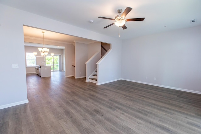 unfurnished room featuring visible vents, baseboards, stairs, ornamental molding, and dark wood-style floors