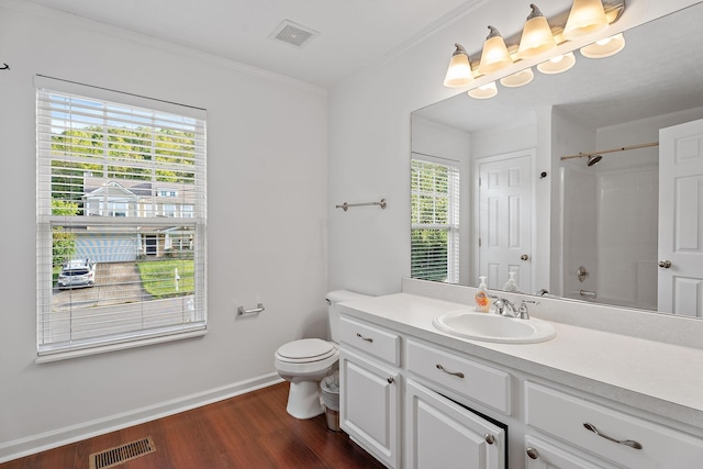 bathroom with visible vents, walk in shower, toilet, and wood finished floors