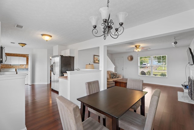 dining room with ceiling fan, a textured ceiling, visible vents, dark wood-style floors, and washing machine and clothes dryer