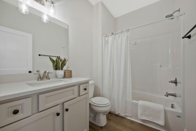 bathroom with toilet, shower / bath combo, wood finished floors, and vanity